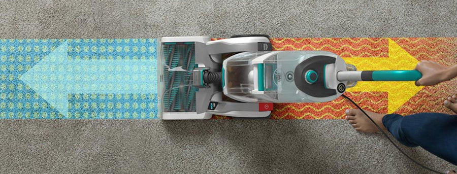 Top view of a Hoover Smartwash+ automatic carpet cleaner in action demonstrating the push to clean and pull to dry feature