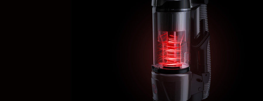 Close up of Hoover vacuum cleaner's dustvault technology wiith red cyclonic filtration, highlighting advanced dust containment and filtration system