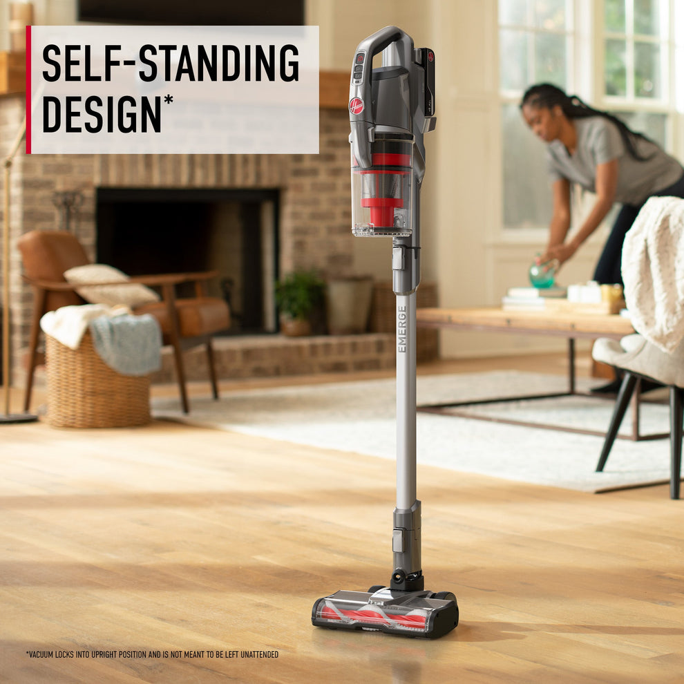 A hoover emerge pet self-standing vacuum cleaner standing upright on a hardwood floor in a living room, demonstrating its ease of use and convenience