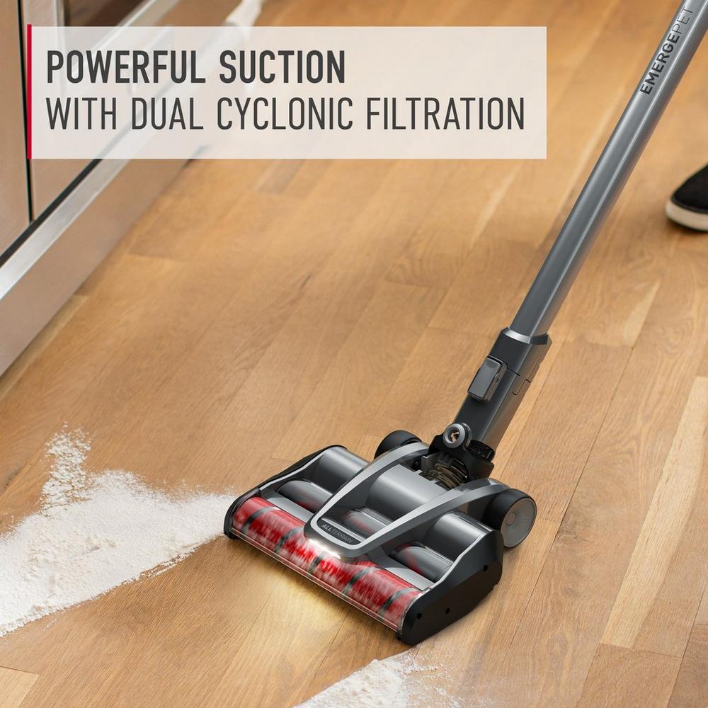 A hoover vacuum cleaner demonstrating its powerful suction with dual cyclonic filtration on a hardwood floor, effectively picking up spilled flour.  