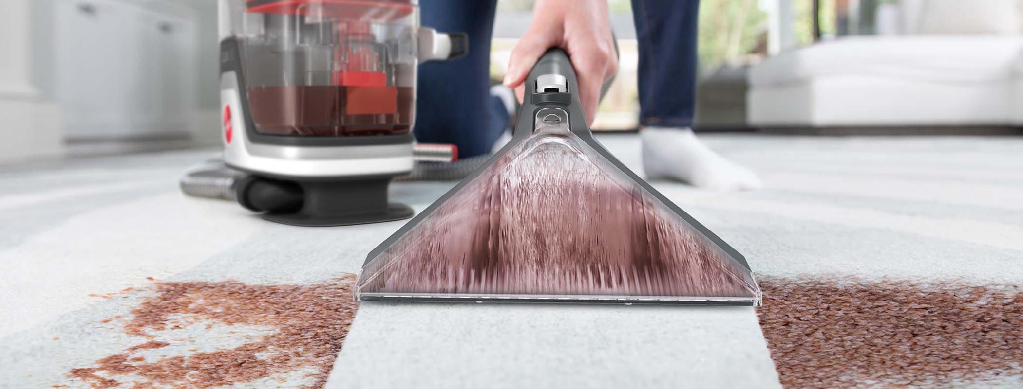 Demonstration of a Hoover Cleanslate portable spot cleaner in action, easily and permanently removing tough spots and stains from a white carpet