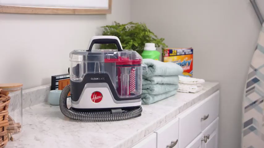 Load video: Cleanslate spot cleaner shown in action removing stubborn stains from a white carpet, white couch, white area rug, and light colored stairs