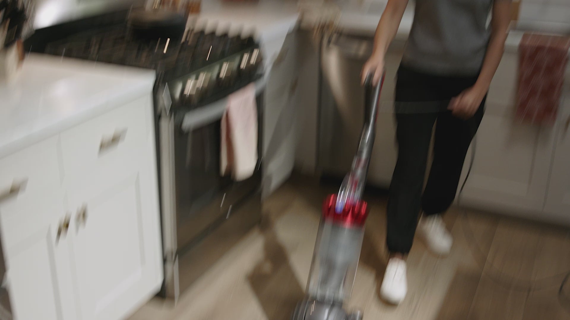 Load video: Hoover windtunnel upright vacuum cleaner is shown beating the competition as it seamlessly vacuums carpets, hardwood floors and area rugs.