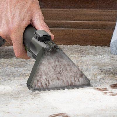 Close up of someone effectively spot cleaning dirt stains out of carpet