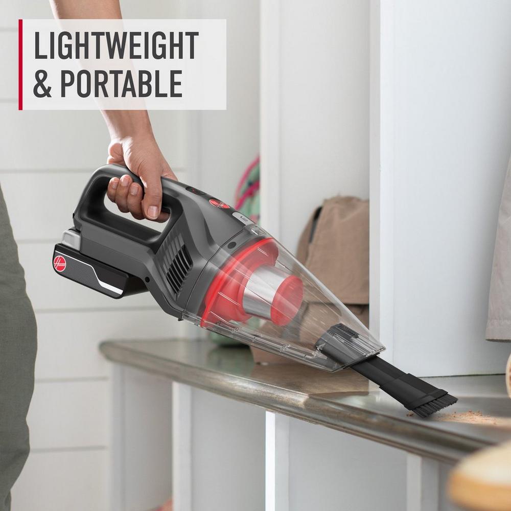 ONEPWR hand vacuum being used to vacuum spilled dirt and debris showcasing its lightweight and portable design.  