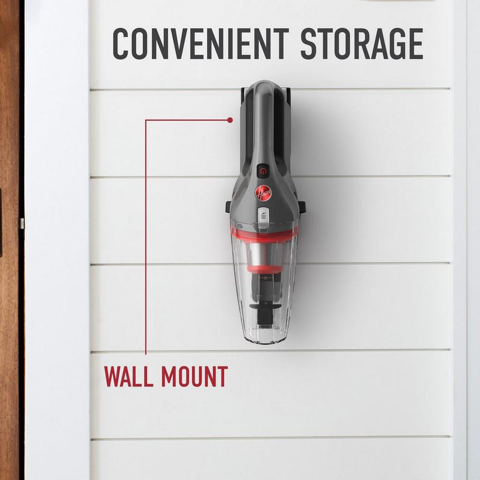 ONEPWR handheld vacuum is shown hanging on the wall mount showcasing its convenient storage.  