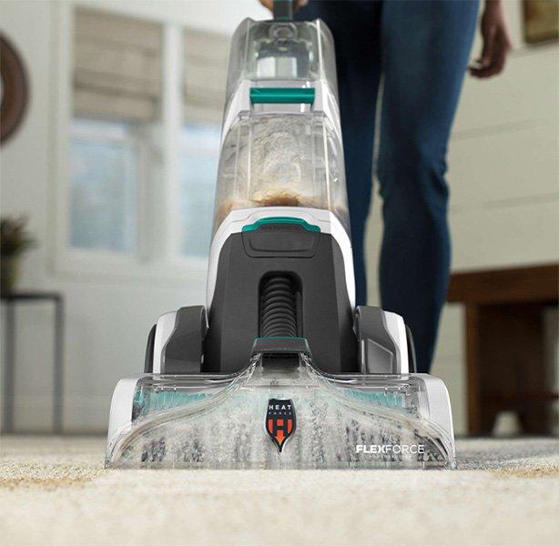 Close-up of a Hoover carpet cleaner with FlexForce technology in action, cleaning a carpet easily and thoroughly.