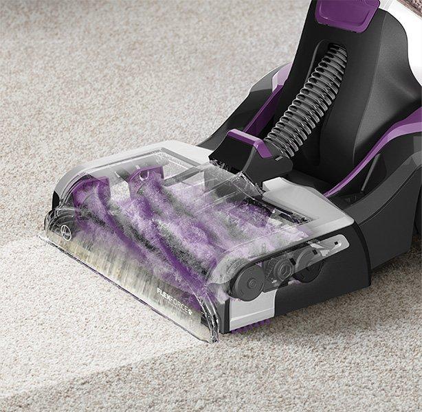 Close up of Hoover smartwash pet carpet cleaner's dual antimicrobial brush rolls in action, highlighting its deep carpet cleaning capabilities  