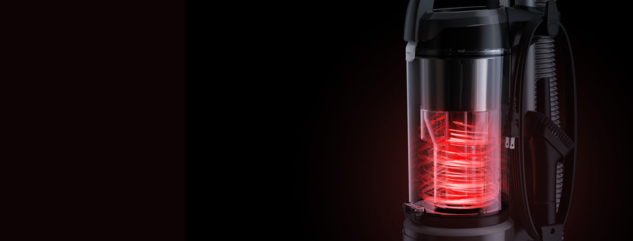 Close up of the dust container on a Hoover vacuum cleaner with red cyclone technology in action showcasing how effective it is in locking in dust for good